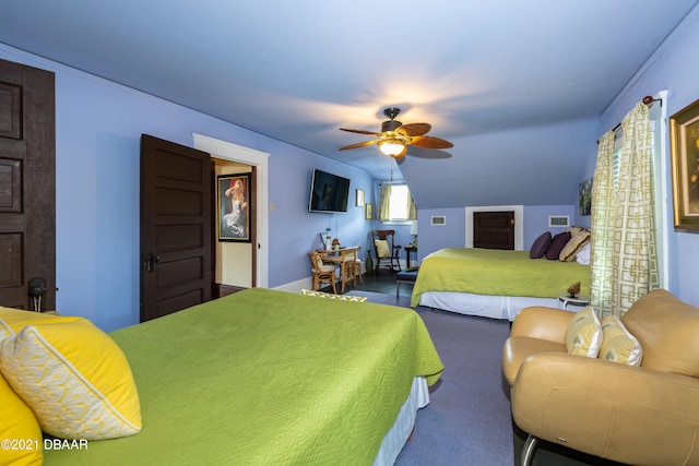 carpeted bedroom featuring lofted ceiling and ceiling fan