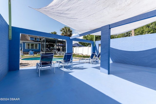 view of patio with a fenced in pool