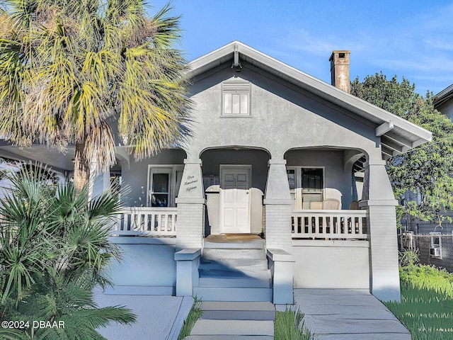 view of front of property featuring covered porch