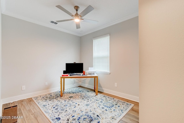 home office with baseboards, ceiling fan, ornamental molding, and wood finished floors