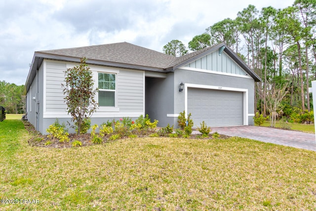 ranch-style house with a shingled roof, an attached garage, decorative driveway, a front lawn, and board and batten siding