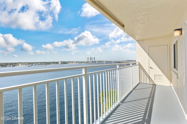 balcony featuring a water view