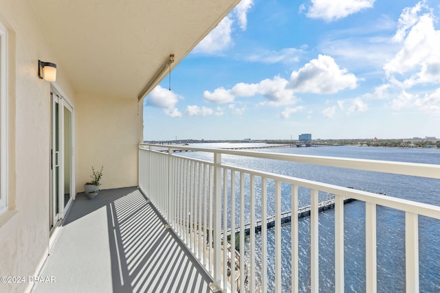 balcony featuring a water view