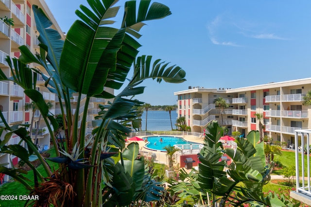 view of swimming pool with a water view