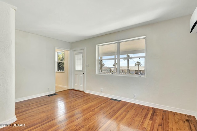 spare room featuring hardwood / wood-style floors