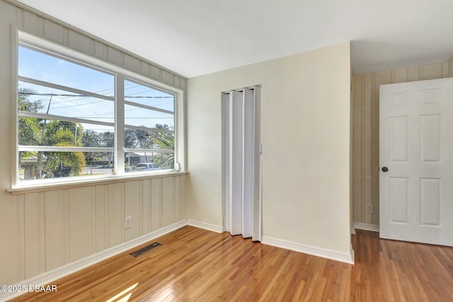 spare room featuring light wood-type flooring