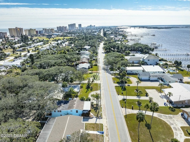 birds eye view of property with a water view