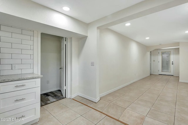 spare room featuring light tile patterned floors