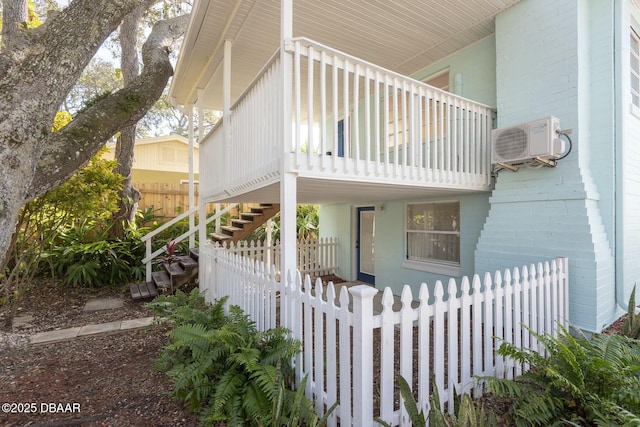 view of side of home with ac unit