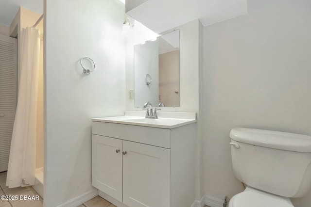 bathroom with tile patterned flooring, vanity, a shower with curtain, and toilet