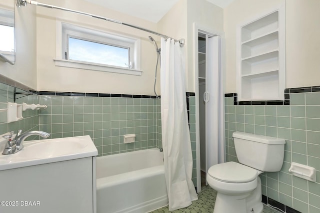 full bathroom featuring tile walls, vanity, toilet, and shower / bath combo with shower curtain