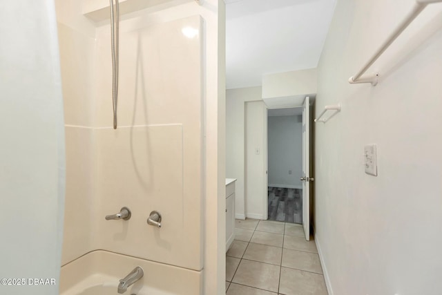 bathroom with tile patterned flooring, vanity, and  shower combination