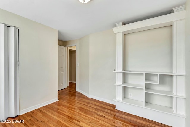 spare room with light hardwood / wood-style flooring