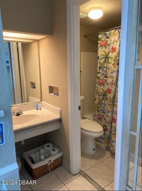 bathroom featuring tile patterned floors, sink, and toilet