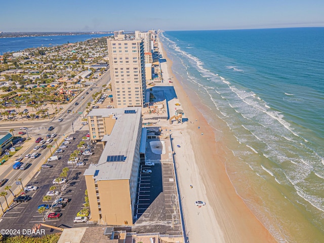 bird's eye view featuring a water view and a view of the beach