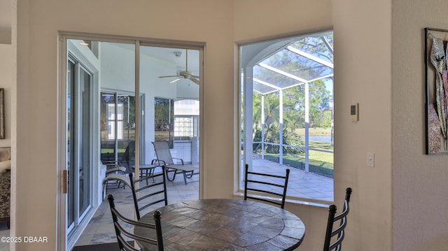 doorway with ceiling fan