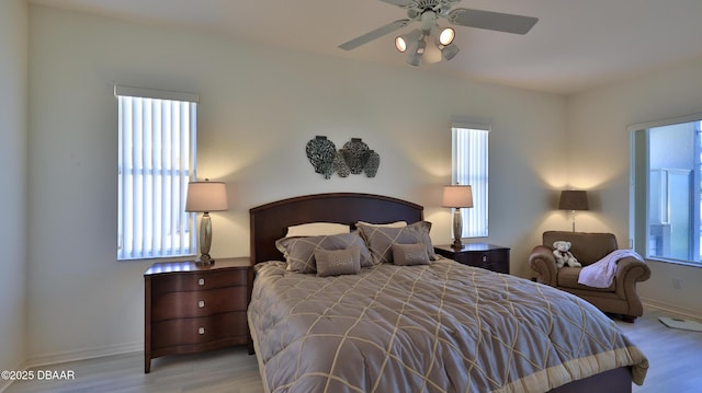 bedroom featuring ceiling fan and light hardwood / wood-style floors