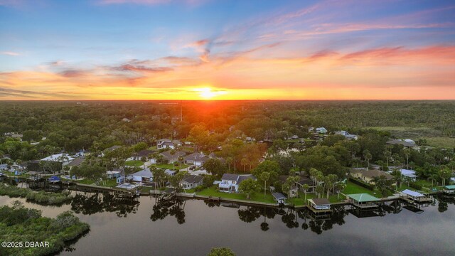 453 Palm Ave, Ormond Beach, FL 32174 - aerial view at dusk of a water view, a wooded view, and a residential view