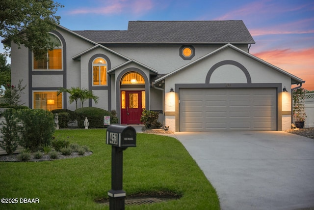 453 Palm Ave, Ormond Beach, FL 32174 - view of front facade featuring driveway, a garage, stucco siding, and a lawn