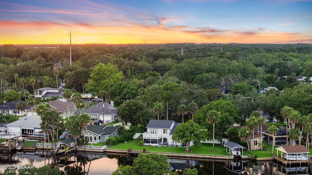 453 Palm Ave, Ormond Beach, FL 32174 - aerial view at dusk of a residential view, a water view, and a wooded view