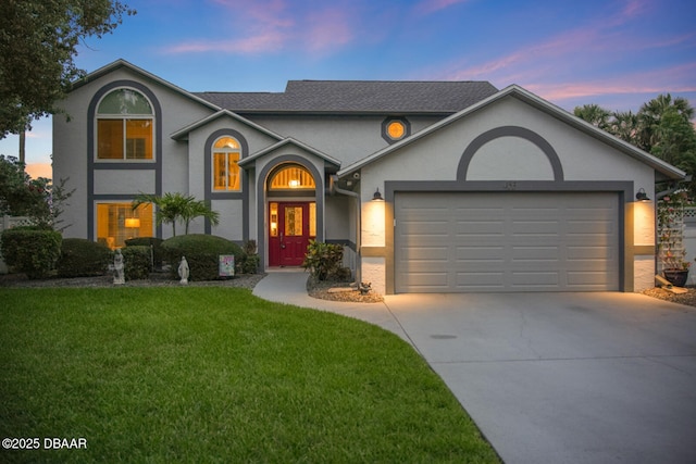 453 Palm Ave, Ormond Beach, FL 32174 - view of front of house with concrete driveway, a garage, stucco siding, and a yard