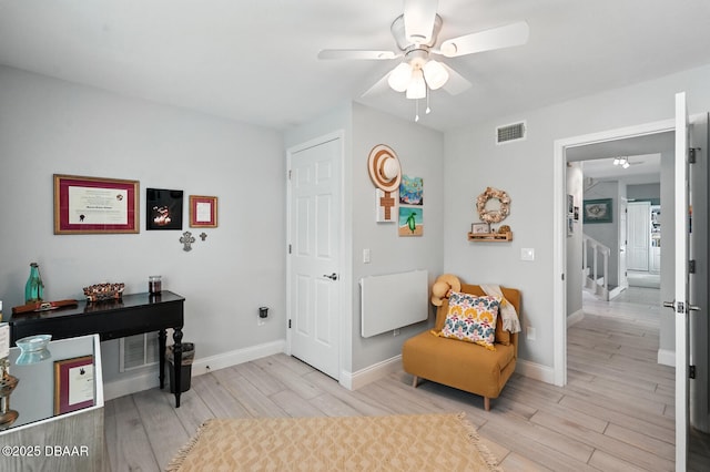 453 Palm Ave, Ormond Beach, FL 32174 - living area featuring ceiling fan, light wood-style floors, and stairway
