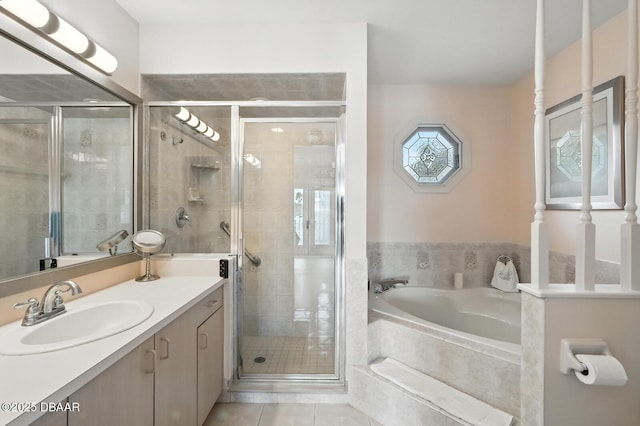453 Palm Ave, Ormond Beach, FL 32174 - bathroom featuring vanity, a bath, a stall shower, and tile patterned flooring