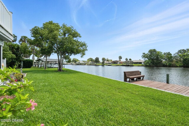 453 Palm Ave, Ormond Beach, FL 32174 - view of grassy yard featuring a water view and a boat dock
