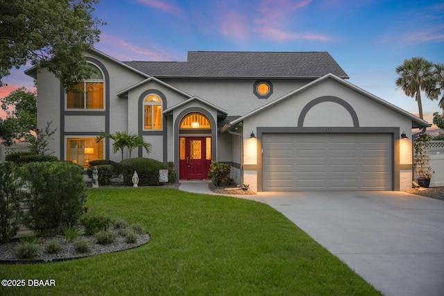 453 Palm Ave, Ormond Beach, FL 32174 - view of front of house featuring stucco siding, concrete driveway, an attached garage, a front yard, and roof with shingles