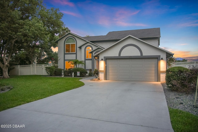 453 Palm Ave, Ormond Beach, FL 32174 - traditional-style house featuring driveway, stucco siding, a garage, and roof with shingles