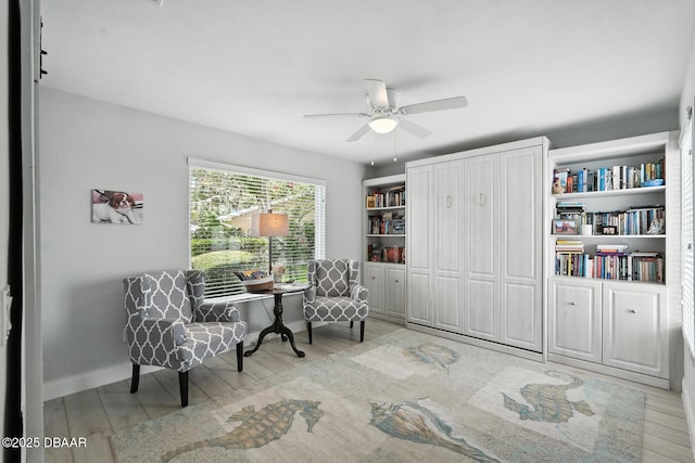 453 Palm Ave, Ormond Beach, FL 32174 - sitting room with wood finished floors and a ceiling fan