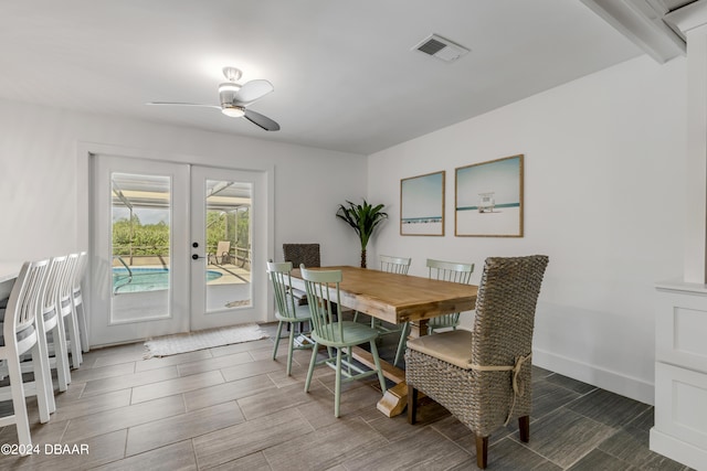 dining space featuring beamed ceiling, french doors, and ceiling fan