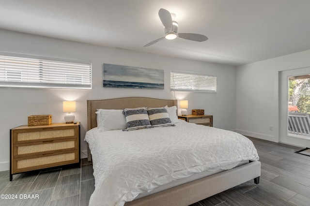 bedroom with access to exterior, ceiling fan, and dark wood-type flooring