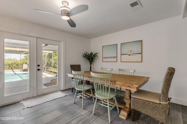 dining area featuring french doors, ceiling fan, and wood-type flooring