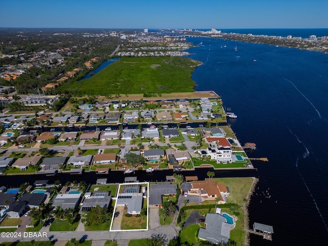 birds eye view of property featuring a water view