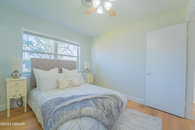 bedroom featuring ceiling fan and light hardwood / wood-style floors