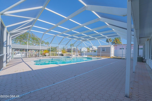 view of pool featuring a lanai and a patio