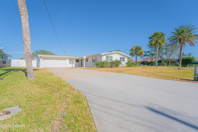 single story home with a garage and a front yard