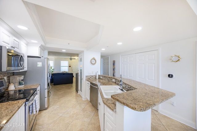 kitchen featuring stainless steel appliances, ceiling fan, sink, light tile patterned floors, and white cabinetry