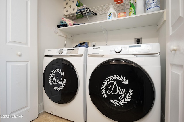 washroom with washing machine and clothes dryer