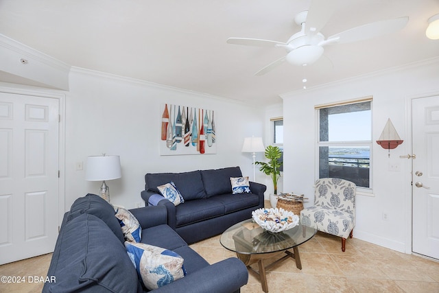 tiled living room with ceiling fan and ornamental molding