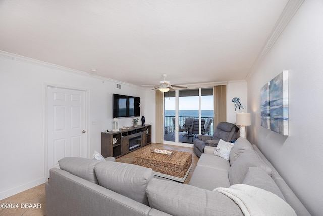 living room featuring ceiling fan and crown molding