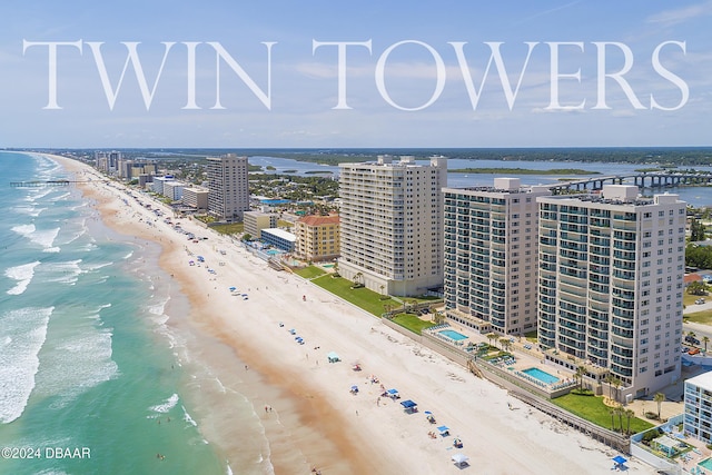 bird's eye view featuring a view of the beach and a water view