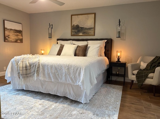 bedroom featuring wood-type flooring and ceiling fan