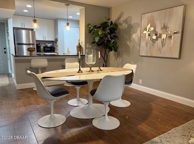 dining room with dark wood-type flooring