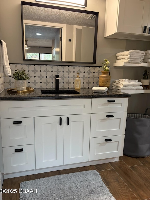 bathroom with vanity and backsplash