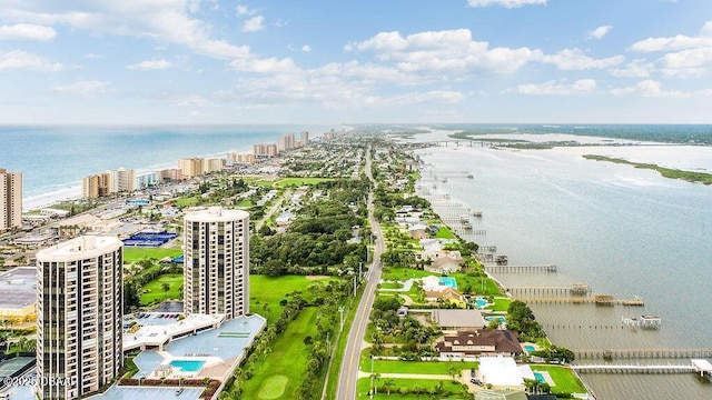 drone / aerial view with a view of city and a water view