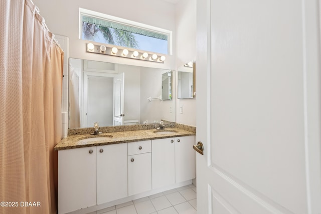 full bathroom with tile patterned flooring, a sink, a shower with shower curtain, and double vanity
