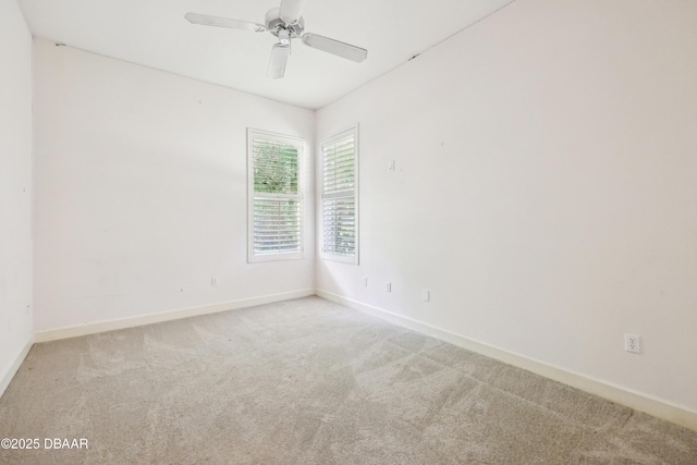 empty room with baseboards, carpet flooring, and ceiling fan
