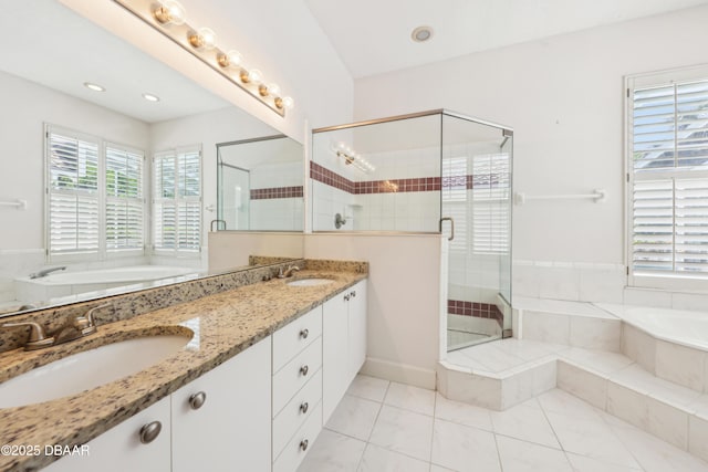 bathroom with tile patterned flooring, a sink, a bath, and a shower stall